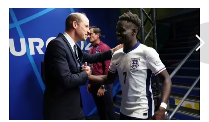 Prince William hugs England goal hero Bukayo saka....